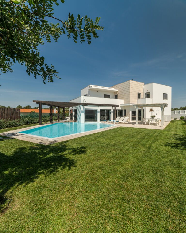 Modern house with garden swimming pool and wooden pergula