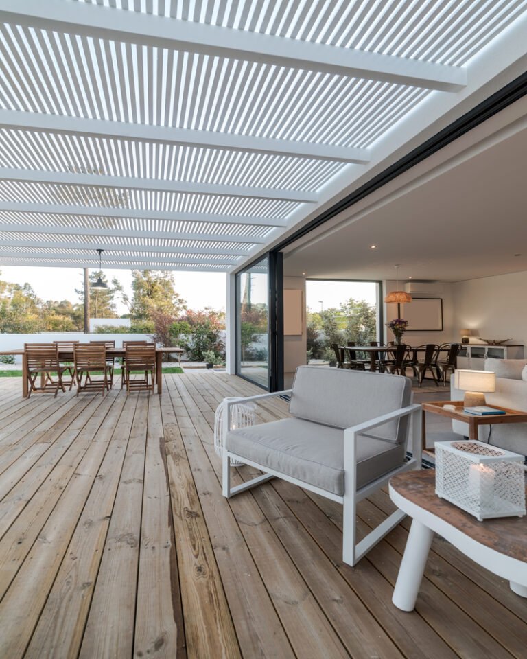 Modern house with garden swimming pool and wooden deck
