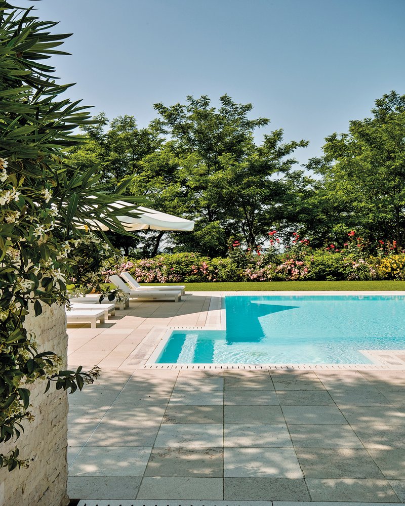 external shots of the garden in foreground the swimming pool
